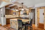This stunning kitchen boasts a rustic yet modern design, perfect for entertaining and everyday living.