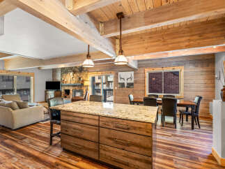 This stunning property boasts a warm and inviting interior with a rustic charm.