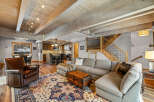 This stunning living space boasts a cozy sectional sofa, perfect for relaxing and entertaining.
