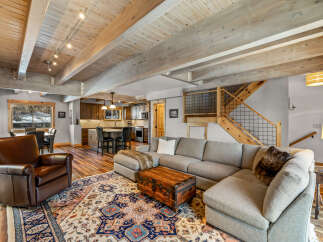 This stunning living space boasts a cozy sectional sofa, perfect for relaxing and entertaining.