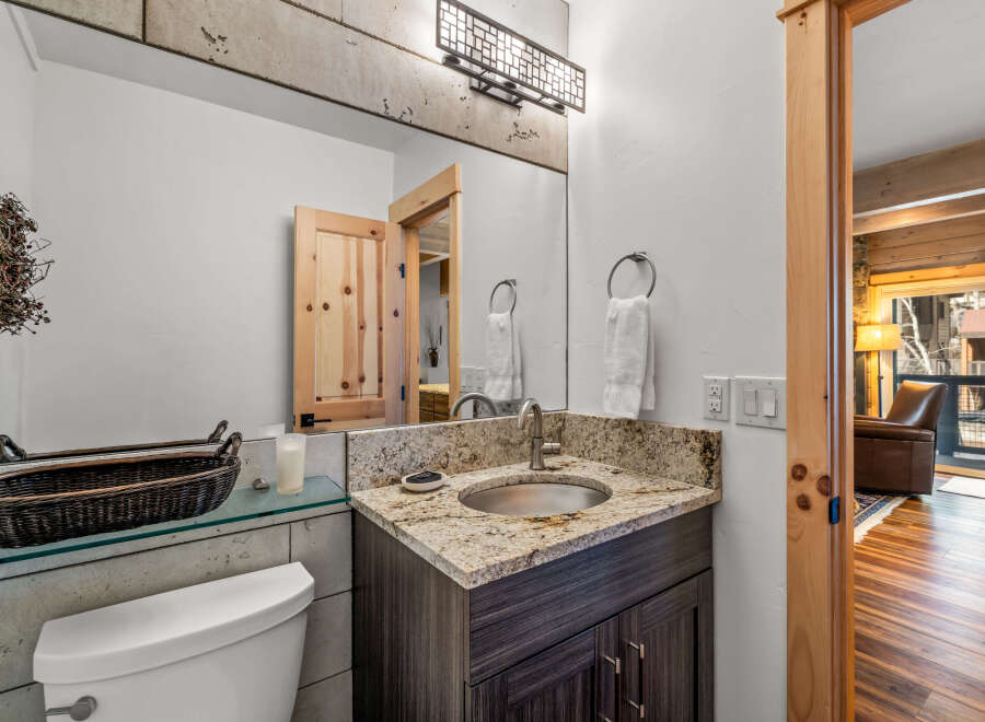 This stunning bathroom boasts a modern design with a touch of rustic charm.