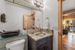 This stunning bathroom boasts a modern design with a touch of rustic charm.