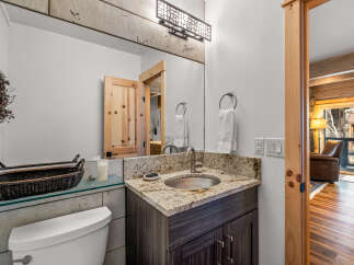 This stunning bathroom boasts a modern design with a touch of rustic charm.