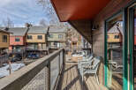 Enjoy stunning views from this charming balcony overlooking a beautiful mountain town.