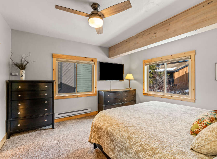 This cozy bedroom features a comfortable bed, perfect for relaxing after a long day.