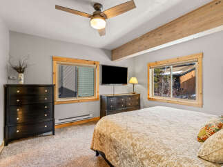 This cozy bedroom features a comfortable bed, perfect for relaxing after a long day.