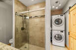 This stunning bathroom features a modern glass shower with a sleek design.