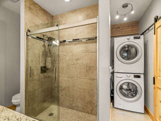 This stunning bathroom features a modern glass shower with a sleek design.