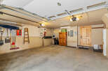 This spacious garage offers ample room for parking and storage.