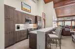This stunning kitchen boasts modern cabinetry, sleek countertops, and high-end appliances, perfect for culinary enthusiasts.