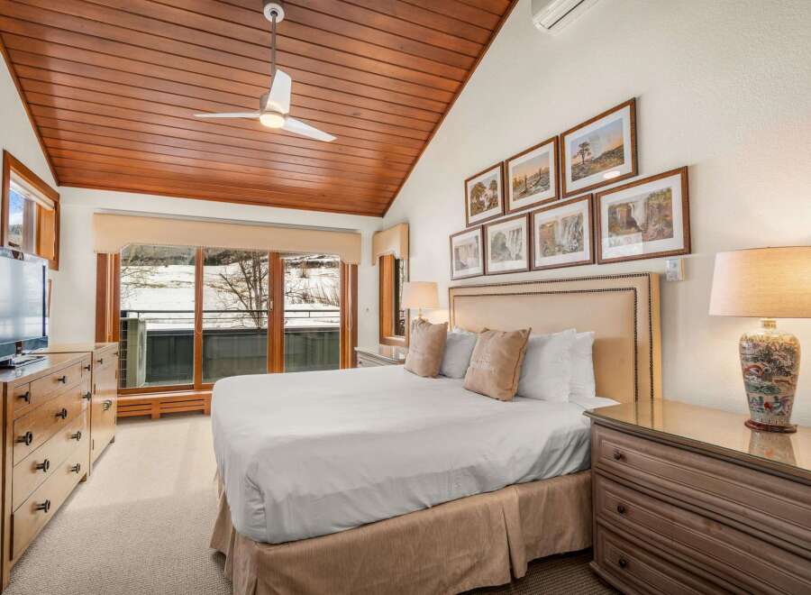 Step into luxury with this stunning bedroom featuring a cozy king-sized bed and elegant decor.