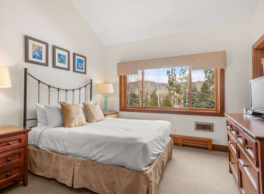 This stunning bedroom offers a serene retreat with its elegant design and breathtaking views.