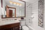 Step into a luxurious bathroom featuring a sleek design and modern amenities.