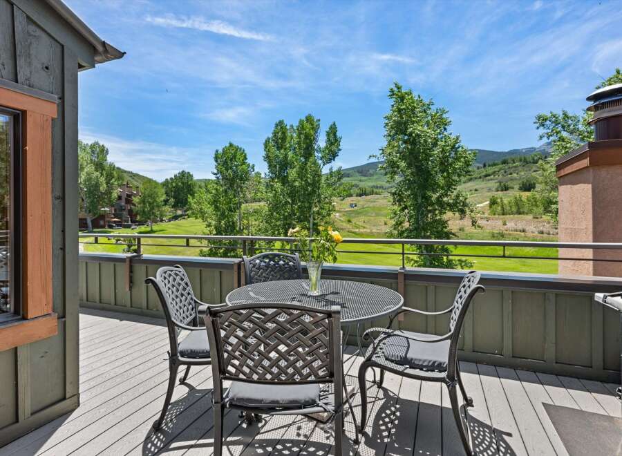 Enjoy breathtaking mountain views from this charming deck, perfect for al fresco dining or morning coffee.