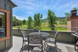 Enjoy breathtaking mountain views from this charming deck, perfect for al fresco dining or morning coffee.