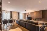 Experience luxury living in this stunning property, featuring a spacious living area with a modern design.