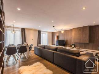 Experience luxury living in this stunning property, featuring a spacious living area with a modern design.