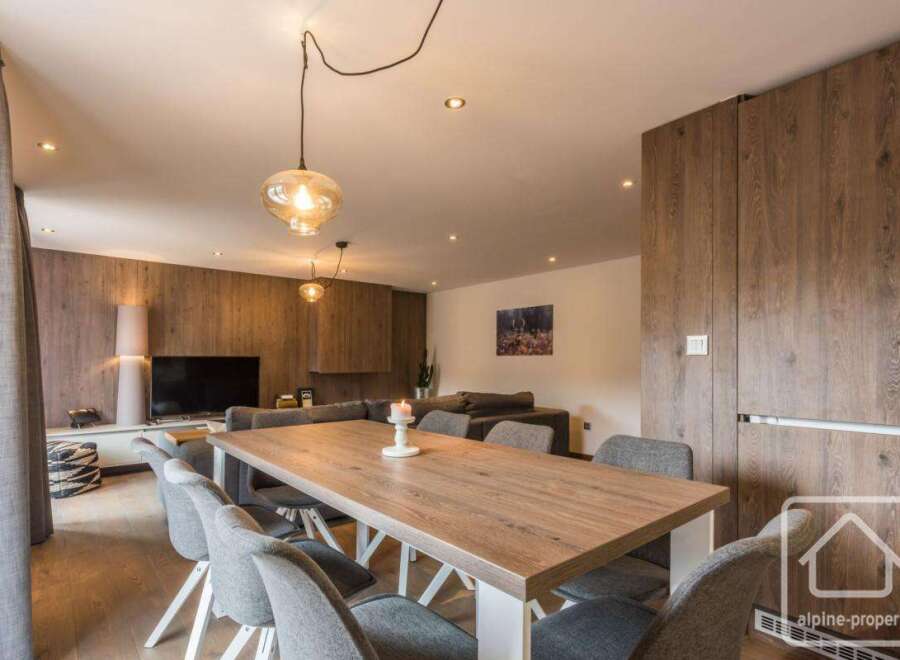 Experience modern living in this stunning property, featuring a spacious dining area perfect for entertaining.