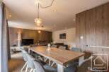 Experience modern living in this stunning property, featuring a spacious dining area perfect for entertaining.