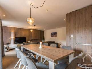 Experience modern living in this stunning property, featuring a spacious dining area perfect for entertaining.