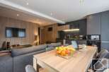 Discover modern living in this stylish property, featuring a seamlessly integrated kitchen and dining area perfect for entertaining.