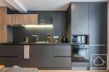 Discover modern living in this stylish kitchen, featuring sleek cabinetry and integrated appliances.