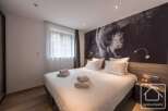 Experience luxury and comfort in this stunning bedroom.