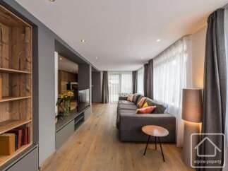 Experience luxury living in this stunning property, featuring a spacious living area with a modern design.