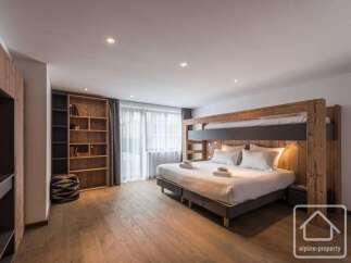 This stunning property boasts a modern bedroom design, featuring a unique bunk bed setup.