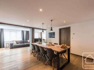 Experience luxury living in this stunning property, featuring a spacious dining area perfect for entertaining.