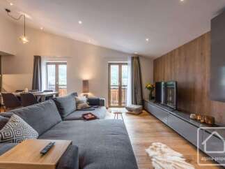 Experience luxury living in this stunning property, featuring a spacious living room with a modern design.