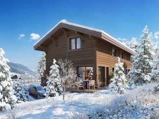 Experience the charm of this stunning wooden cabin nestled in a snowy landscape.