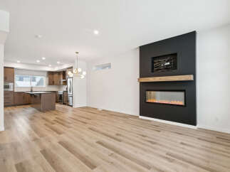 Step into modern luxury with this stunning property! Featuring a sleek, open-concept design, this home boasts beautiful hardwood floors and a cozy fireplace, perfect for relaxing evenings.