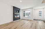 This stunning property boasts a modern living space with a sleek fireplace, perfect for cozy evenings.