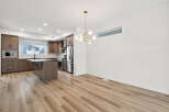 Step into modern elegance with this stunning kitchen and dining area.