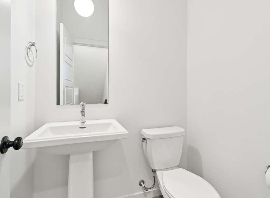 This pristine bathroom showcases a modern design with clean lines and a bright, airy feel.