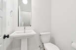 This pristine bathroom showcases a modern design with clean lines and a bright, airy feel.