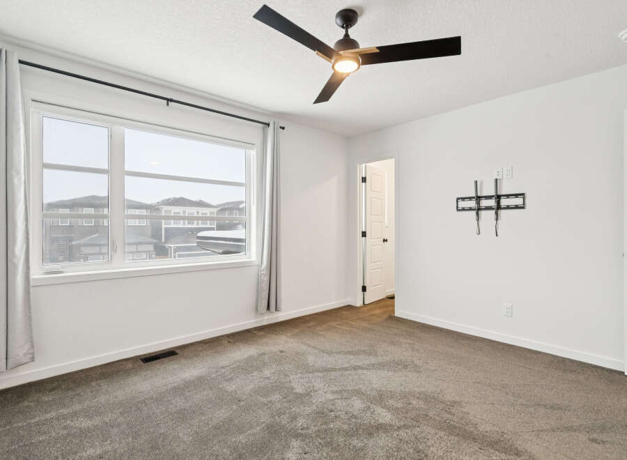 This bright and airy bedroom offers a clean and modern aesthetic, perfect for relaxation.