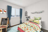 This charming bedroom offers a cozy and inviting atmosphere, perfect for relaxation.