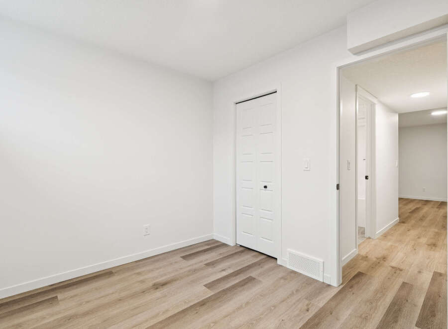 This bright and airy room features a neutral color palette, creating a versatile space ready for your personal touch.