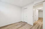 This bright and airy room features a neutral color palette, creating a versatile space ready for your personal touch.