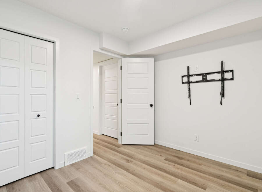 Step into this bright and airy space, featuring pristine white walls and modern finishes.