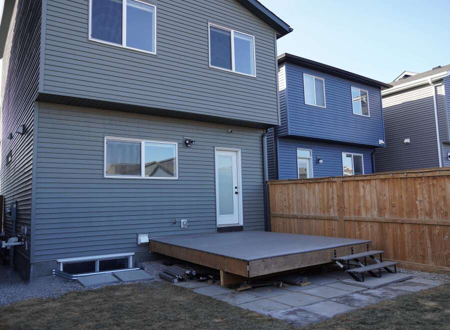 This stunning property boasts a modern design with sleek siding and ample natural light.