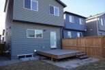 This stunning property boasts a modern design with sleek siding and ample natural light.