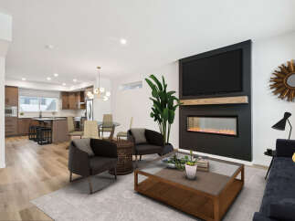 Step into luxury with this stunning property, featuring a modern living room with a sleek fireplace and a large flat-screen TV.