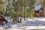 Nestled in a serene winter wonderland, this stunning property offers a perfect blend of natural beauty and modern comfort.