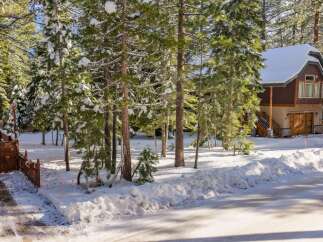 Nestled in a serene winter wonderland, this stunning property offers a perfect blend of natural beauty and modern comfort.