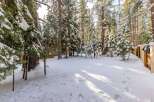 Nestled in a serene winter wonderland, this property offers a picturesque escape.