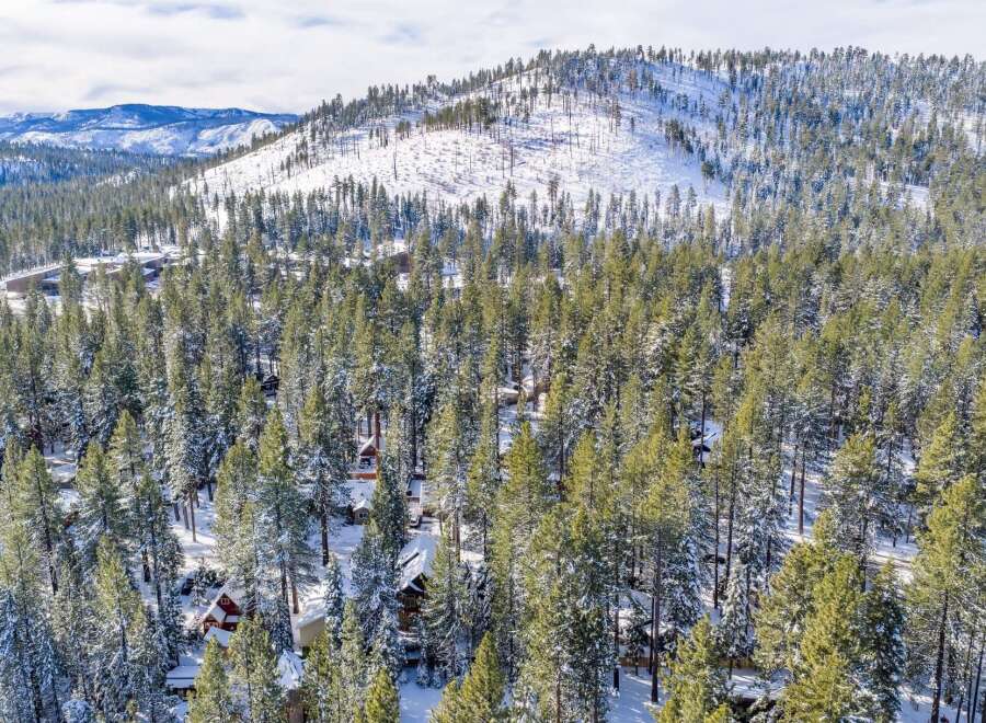Nestled amidst a serene winter wonderland, this property offers a unique blend of natural beauty and modern comfort.