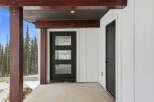 This stunning property features a modern black front door with glass panels, offering a stylish entrance.